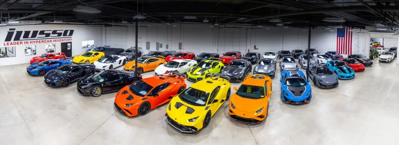 Dealership showroom filled with Lamborghini, McLaren and Porsche supercars